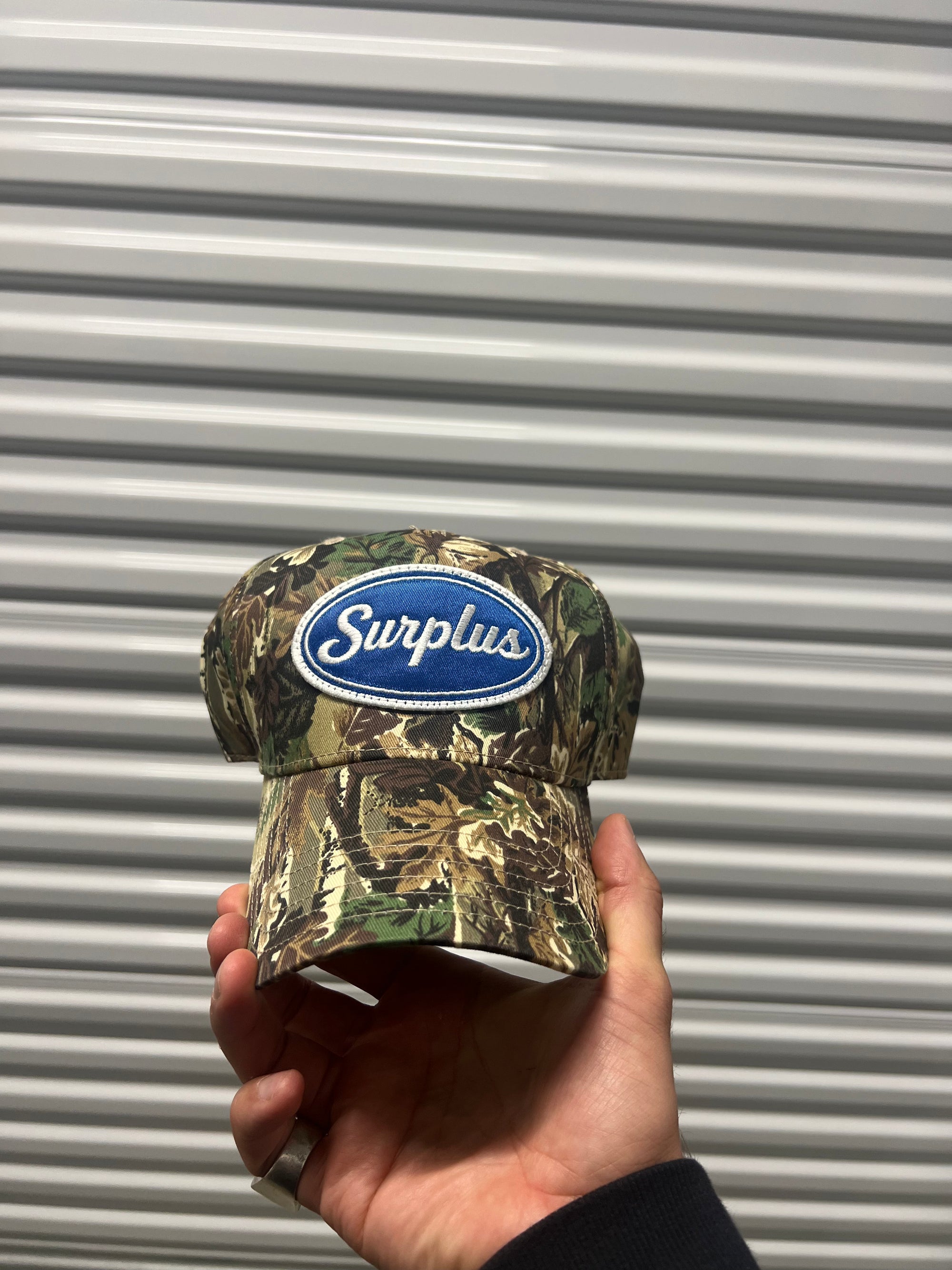surplus blue oval snapback / real tree camo/royal blue