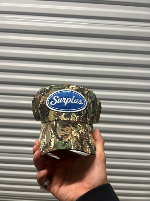 surplus blue oval snapback / real tree camo/royal blue