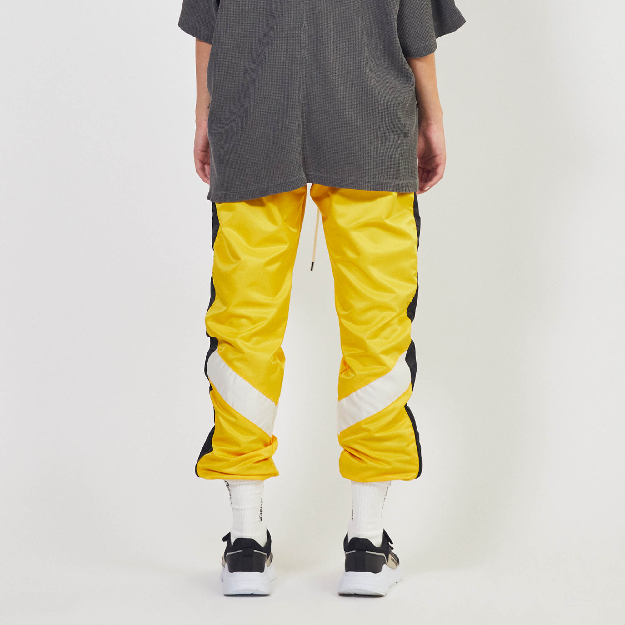 Black and outlet yellow track pants